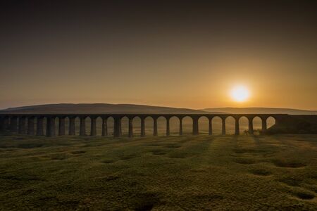 Sunset over Iconic Yorkshire Landmark Ribblehead Viaductの写真素材