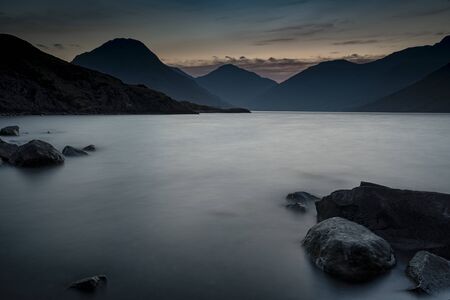 Sunrise over Wast Water a lake located in Wasdale, a valley in the western part of the Lake District National Park, England, it is the deepest lake in England at 258 feetの写真素材