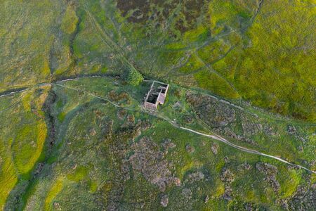 An aerial Sunrise drone shot of Top Withens or Top Withins, this farmhouse has been associated with "Wuthering Heights".の写真素材
