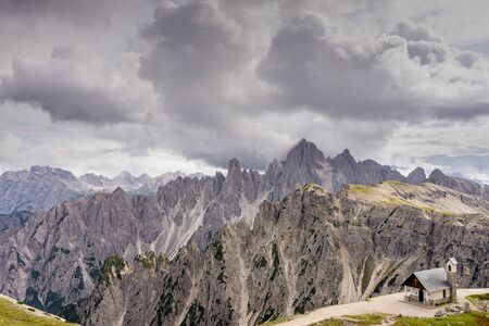 Breathtaking summer scenic landscape view of iconic Cappella degli Alpini chapel in the Dolomites mountain range, South Tirol Alps, Italy, Europeの写真素材