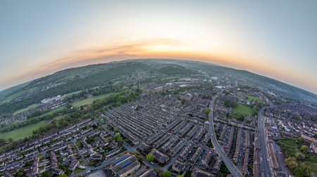 Aerial View of Saltaire Village at Sunrise with Surrounding Hillsの写真素材