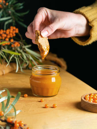 Sea buckthorn berries and sea buckthorn jam jarの写真素材