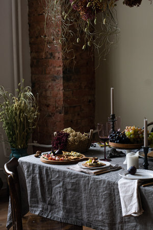 Fancy Table setting set with candles and flowers. Vertical