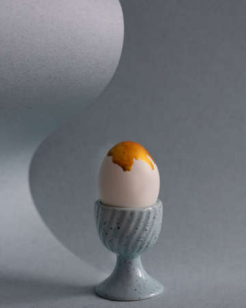 easter egg with streaks of golden paint. Creative Easter ideaの写真素材