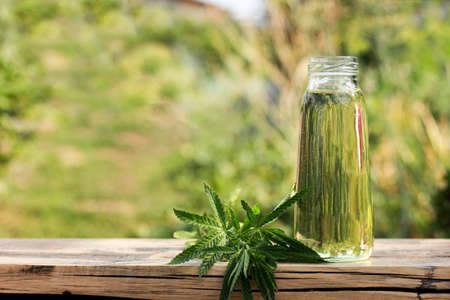 hemp oil in a glass jar with hemp leaf, hemp extracts, healthの写真素材