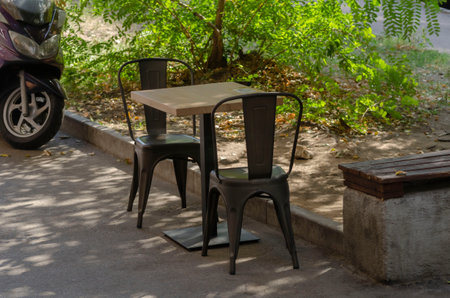 Garden table with two chairs is outdoorsの写真素材