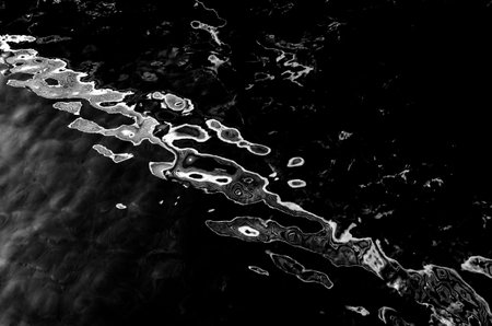 water surface making multiple water circles against blue background beauty product background, water-based concept there is space for textの写真素材