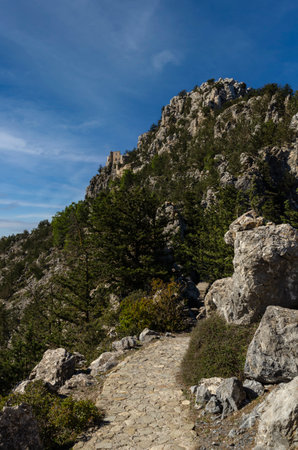 view of the stone road in the mountains in the foreground Cyprus Buffavento castleの写真素材