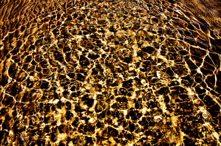 great background whimsical patterns on the sand across the water horizontal orientation good for photo wallpaperの写真素材