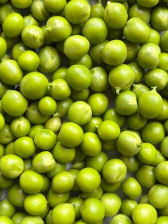 Close-up of fresh green peas, healthy food background, organic vegetable texture, macro photography