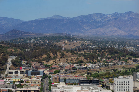 California Los Angeles September 4, 2025 Panoramic view of city with houses, mountains and clouds on clear sunny day in Californiaの写真素材