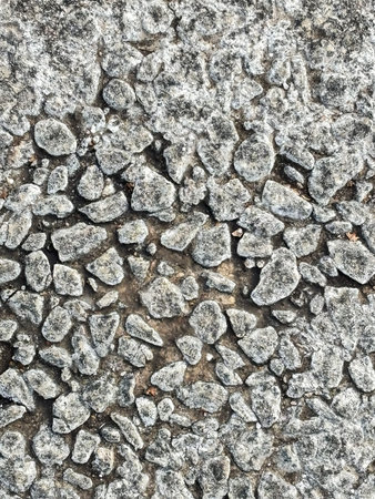 Winter frosty textured stone surface background with icy pattern creating natural backdrop for...