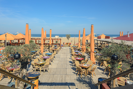 Scheveningen, The Netherlands - May 13, 2016: The terrace of a beachclub on the boulevard in Scheveningen.のeditorial素材