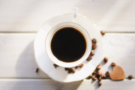 Morning coffee on a white background coffee beans scattered, love and good memories.の写真素材