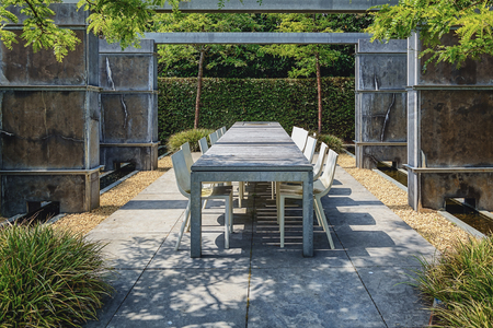 Appeltern, The Netherlands, July 22, 2015: The Gardens of Appeltern is the inspiration garden park in the Netherlands. In this picture trendy a terrace 
with trendy garden furniture between concrete fences.のeditorial素材