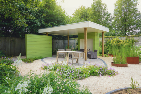 Appeltern, The Netherlands, July 22, 2015: The Gardens of Appeltern is the inspiration garden park in the Netherlands. In this picture a garden with terrace and overhang, decorated with trendy garden furniture and planters.のeditorial素材