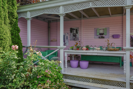 Appeltern, The Netherlands, July 22, 2015: The Gardens of Appeltern is the inspiration garden park in the Netherlands. In this picture a patio painted in pastel tones and furnished as a living room.のeditorial素材