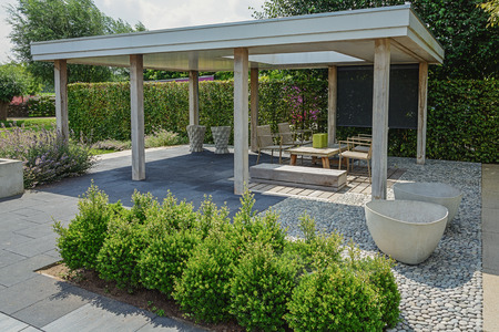 Appeltern, The Netherlands, July 22, 2015: The Gardens of Appeltern is the inspiration garden park in the Netherlands. In this picture an open patio with garden furniture and other decorations.のeditorial素材