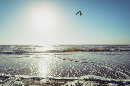 Netherlands, lonely kiter  at the North Sea beach in the evening.の写真素材