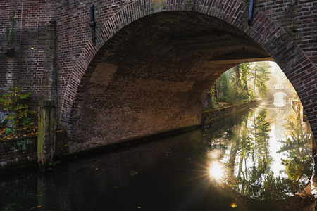 The Nieuwegracht with its arched bridges in the old town of Utrecht.の写真素材