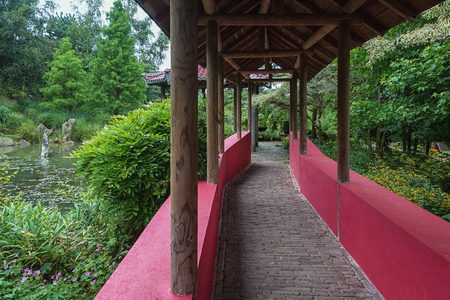 Landgraaf, Netherlands - July 12, 2016: Chinese garden which is crossed by a covered walkway stand with walls symbolizing the Great Wall.のeditorial素材