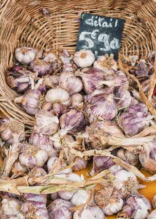 Garlic in a basket with a price tagの写真素材