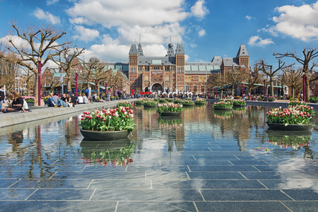 Amsterdam, Netherlands, April 10, 2016: planters filled with tulips  in the pond during the Tulip Festival in Amsterdam with in the background The Rijksmuseumのeditorial素材