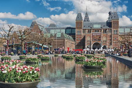 Amsterdam, Netherlands, April 10, 2016: planters filled with tulips  in the pond during the Tulip Festival in Amsterdam with in the background The Rijksmuseumのeditorial素材