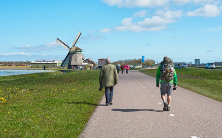 Zijpe, Netherlands - May 1, 2016: participants in the organized walk Flowering Zijpe in the head of...