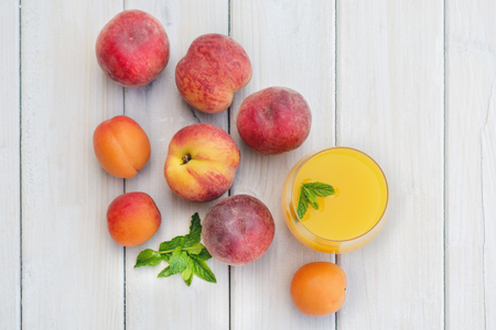 Composition with apricots and nectarines  on a white tableの写真素材