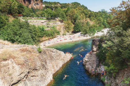 Thueyts, France, september 11, 2016: swimmers in the river Ardeche near the devils bridge in the village of Thueyts in the Ardeche department in Franceのeditorial素材