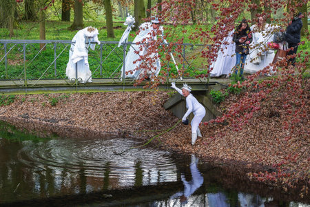 Haarzuilens, Netherlands - April 24, 2016: a fairy is dragging the ditch on the guess of another fairy at The Elf Fantasy Fair (Elfia), an outdoor fantasy event in the Netherlands.のeditorial素材