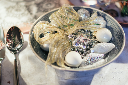 Plate for decoration filled with different types of Christmas baublesの写真素材