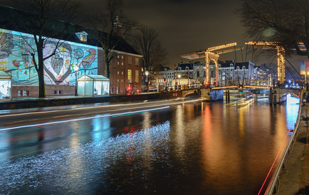 Amsterdam, Netherlands, December 16, 2017:  Slide projection of modern art on the side wall of The Hermitage Museum during the Festival of Light in Amsterdamのeditorial素材