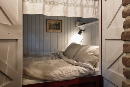 Musselkanaal, The Netherlands, November 7, 2017: Old fashioned bedstaed in a farm.のeditorial素材