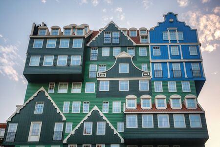 Zaandam, The Netherlands, April 18, 2019: The famous Inntel hotel in the center of Zaandam with on the outside the different facades that were known in historical Zaandamのeditorial素材