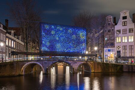 Amsterdam, Netherlands - January 14, 2019: Light Festival Amsterdam, giant blue light object placed on a bridge over the Herengracht in the old town of Amsterdamのeditorial素材
