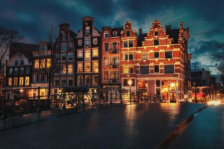 Amsterdam, Netherlands - January 14, 2019: Beautiful canal houses on the corner of Brouwersgracht and Prinsengracht in the old center of Amsterdam in The Netherlands during sunsetのeditorial素材