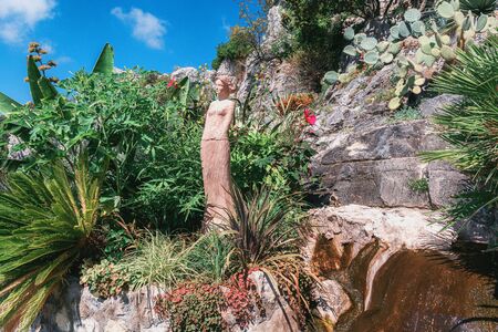 Eze, France, September 5, 2018:  Beautiful sculpture in the garden of the in the beautiful botanical garden with exotic plants like cacti and yuccas in the village of Eze in Franceのeditorial素材
