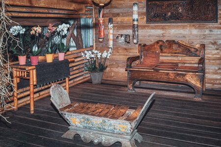 Luttelgeest, The Netherlands, November 14, 2018: The colonial interior of a log cabin in the rainforest in the covered park the Orchideeën Hoeveのeditorial素材