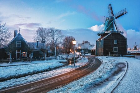 Zaanstad, Netherlands, January 30, 2015: Small mill and typical Zaanse houses on the Zaans Schans in winter located on the river The Zaan in the Netherlandsのeditorial素材