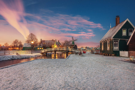 Zaanstad, Netherlands, January 30, 2015: Small mill and typical Zaanse houses on the Zaans Schans in winter located on the river The Zaan in the Netherlandsのeditorial素材