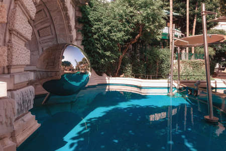 Mirror sphere in a pond in the garden near Monte Carlo Casino in Monacoのeditorial素材