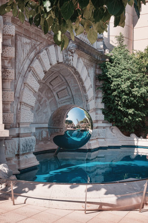 Mirror sphere in a pond in the garden near Monte Carlo Casino in Monaco