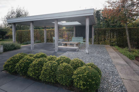 Terrace with modern garden furniture under a canopy in the garden.の写真素材