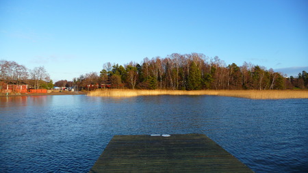 Northern lake in autumnの写真素材
