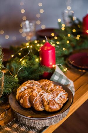 Sweet Christmas cake on table in roomの写真素材