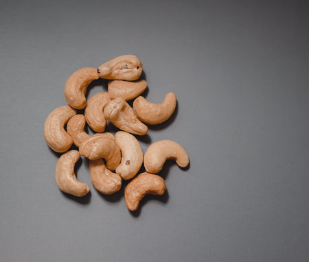 handful of nuts on a plain background grey
