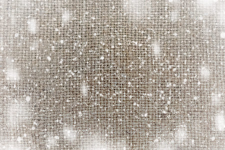 sackcloth texture background with the snow flakesの写真素材
