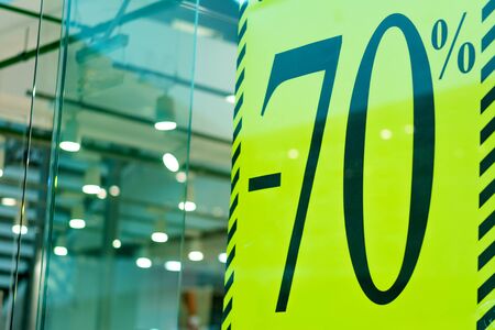 Sale sign 70 percent in a fashion clothes shop display windowの写真素材